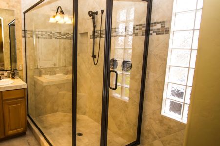 Black framed glass shower enclosure with hinged door